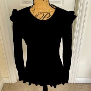 Women’s black sweater.